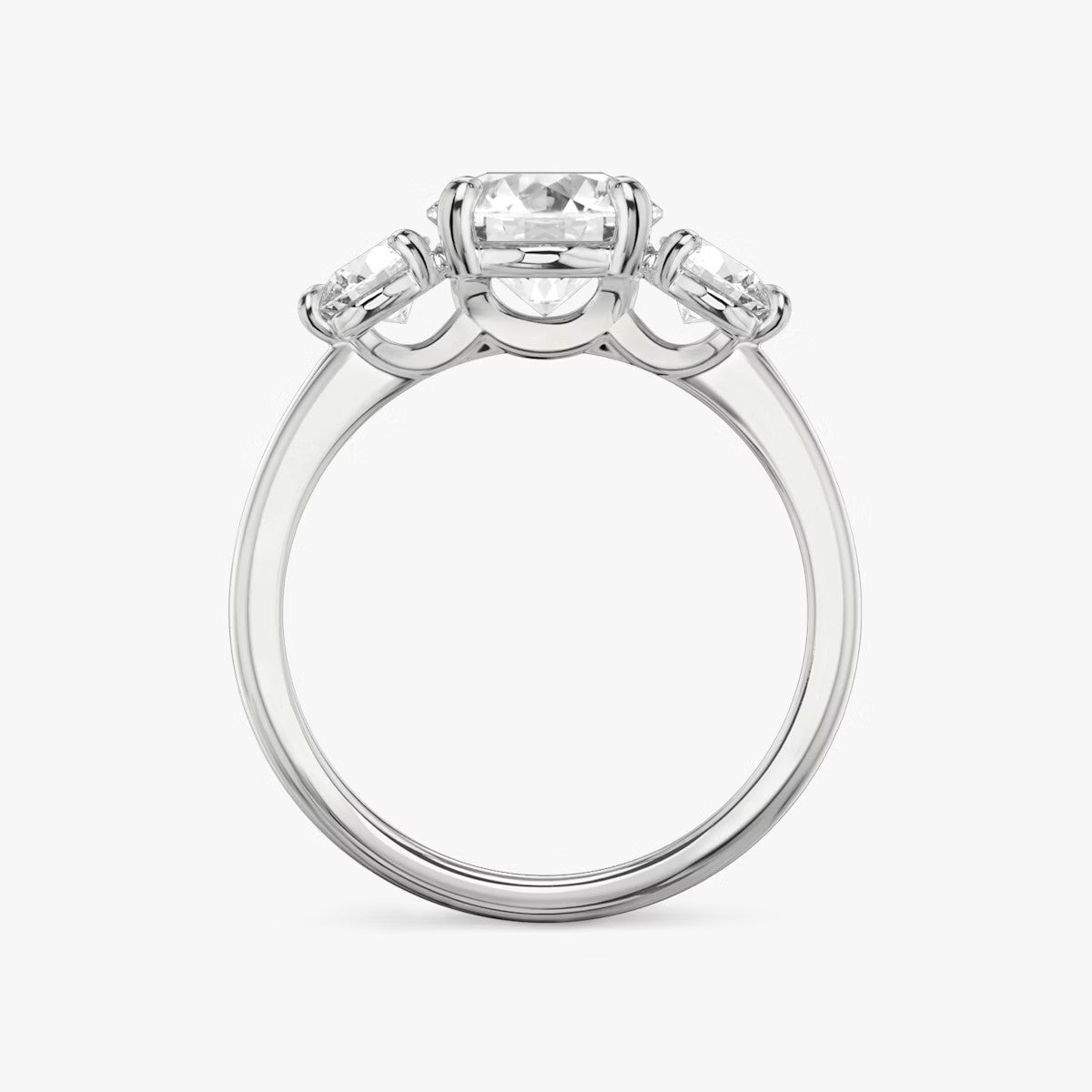 The Three Stone Round Brilliant with Round Side Stones Engagement Ring