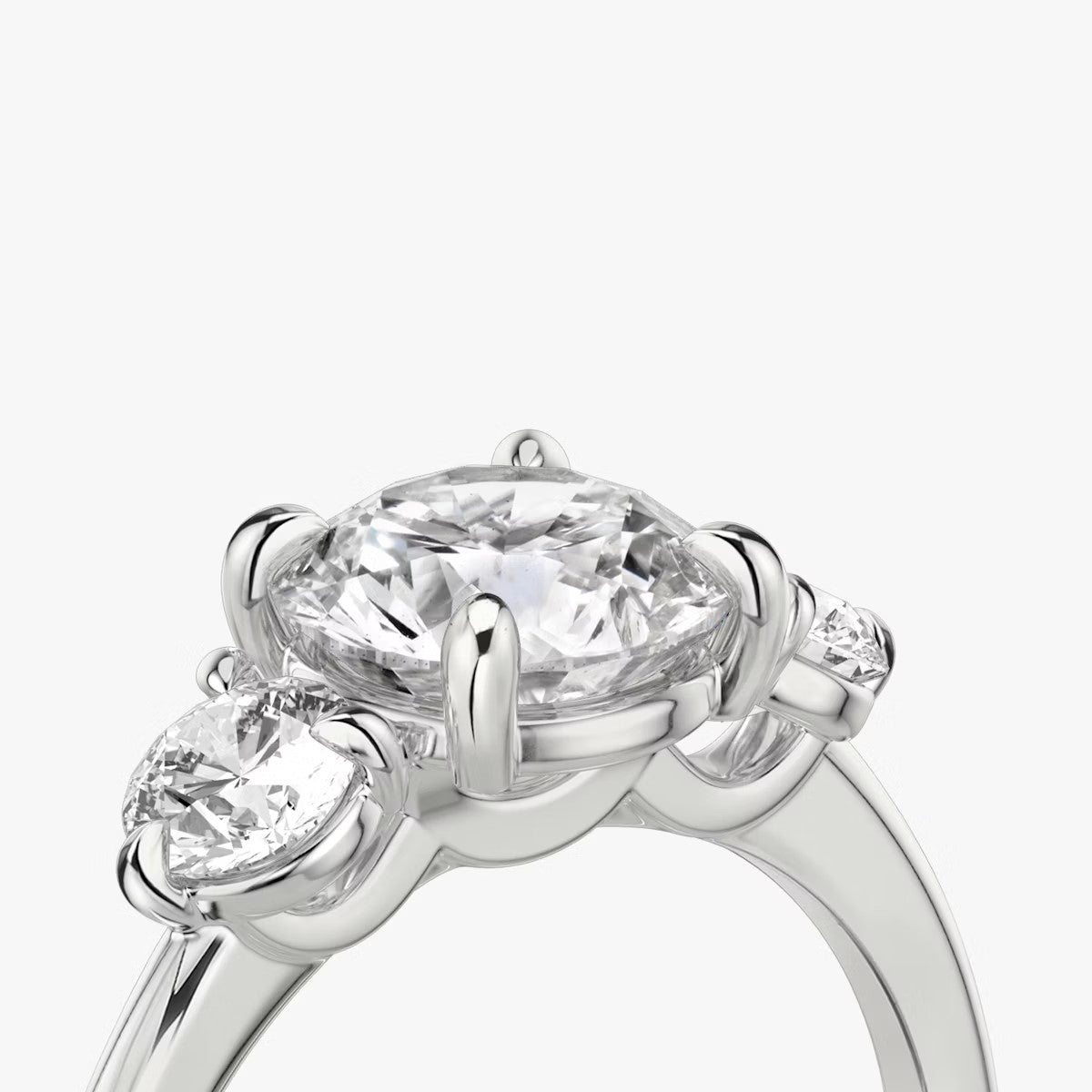 The Three Stone Round Brilliant with Round Side Stones Engagement Ring