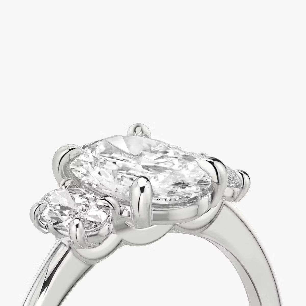 The Three Stone Oval with Oval sidestones Engagement Ring