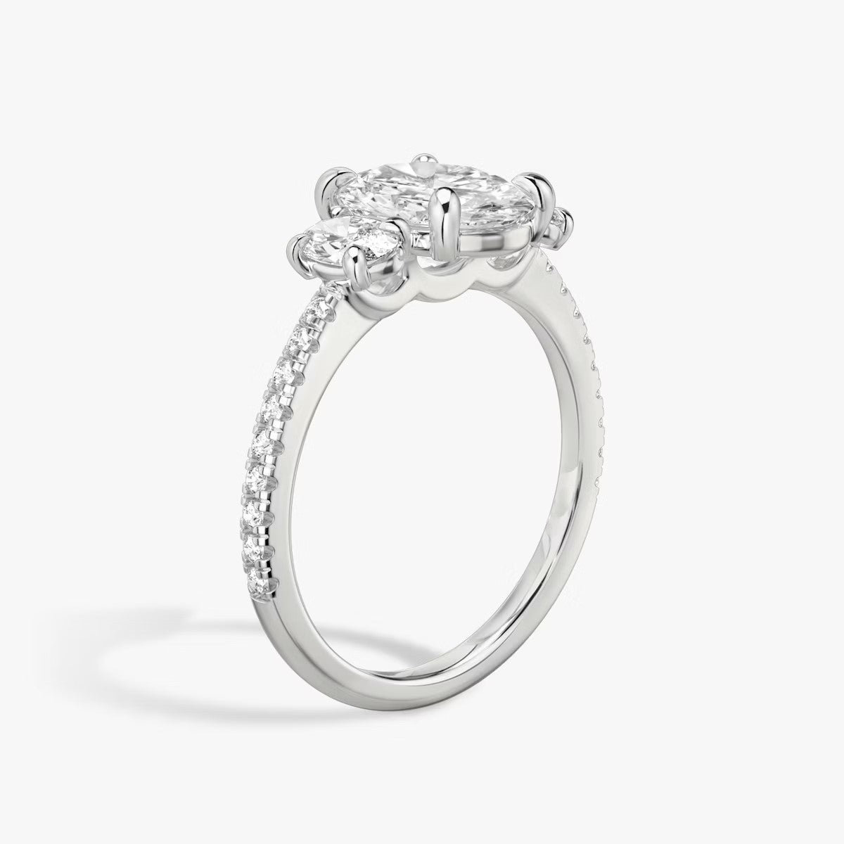 The Three Stone Oval with Oval Side Stones Pave Engagement Ring