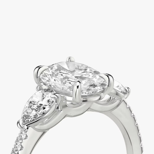 The Three Stone Oval with Pear Side Stones Pave Engagement Ring