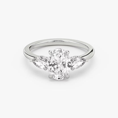 The Three Stone Oval with Pear side stones Engagement Ring