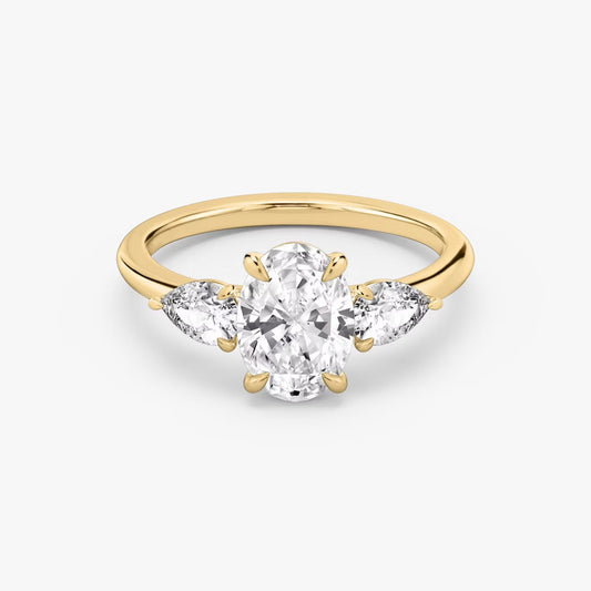 The Three Stone Oval with Pear side stones Engagement Ring