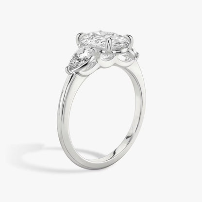 The Three Stone Oval with Pear side stones Engagement Ring