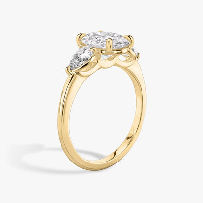 The Three Stone Oval with Pear side stones Engagement Ring