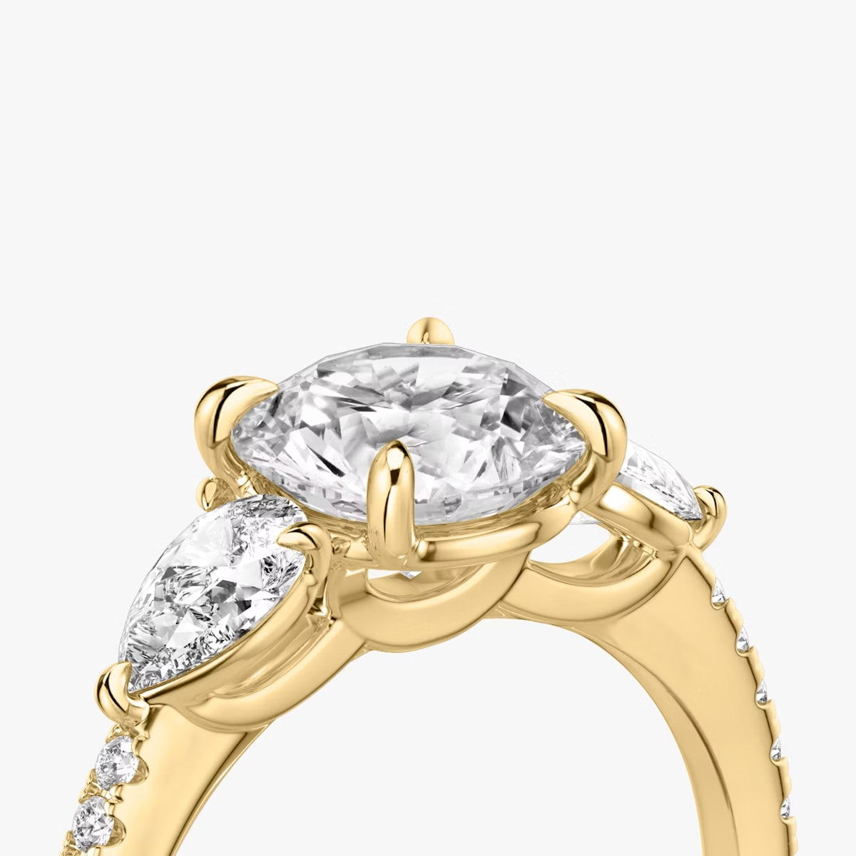 The Three Stone Round Brilliant with Pear Side Stones Pave Engagement Ring