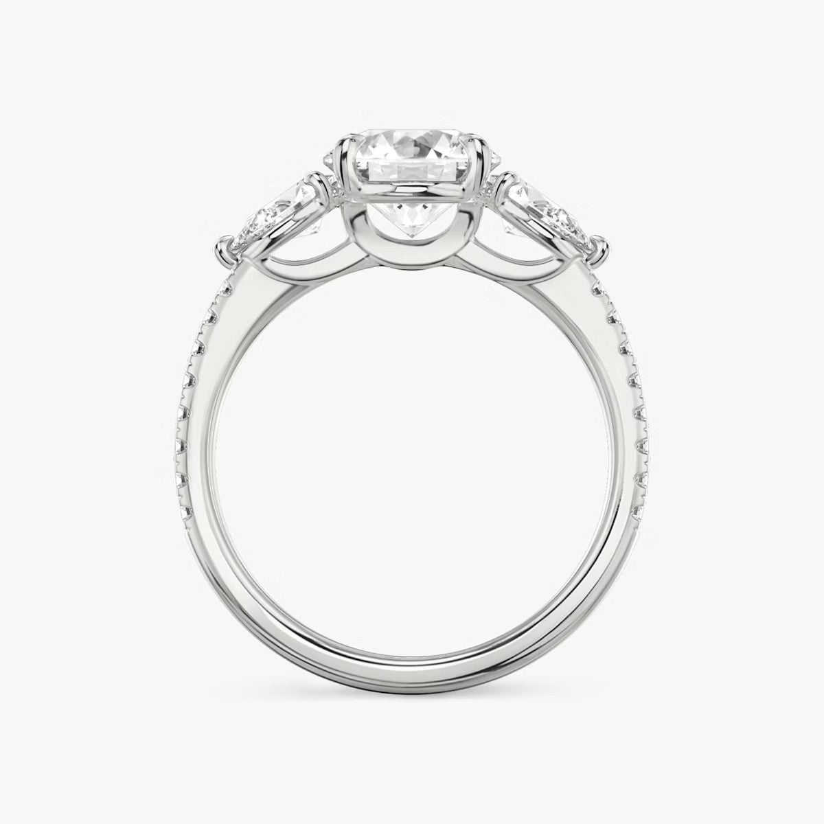 The Three Stone Round Brilliant with Pear Side Stones Pave Engagement Ring