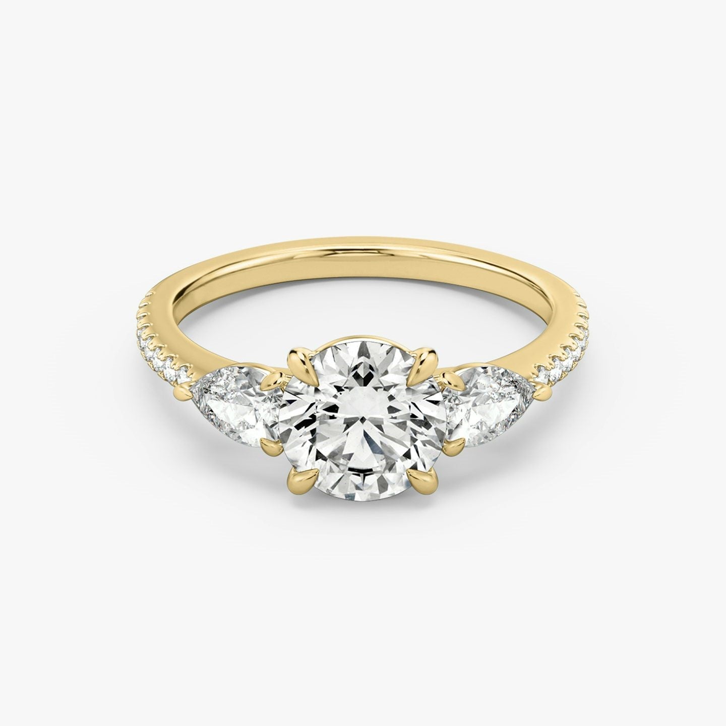 The Three Stone Round Brilliant with Pear Side Stones Pave Engagement Ring