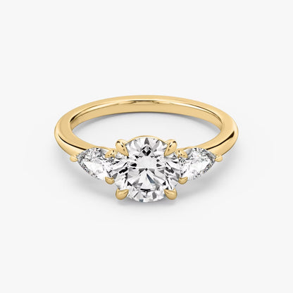 The Three Stone Round Brilliant With Pear Side Stones Engagement Ring