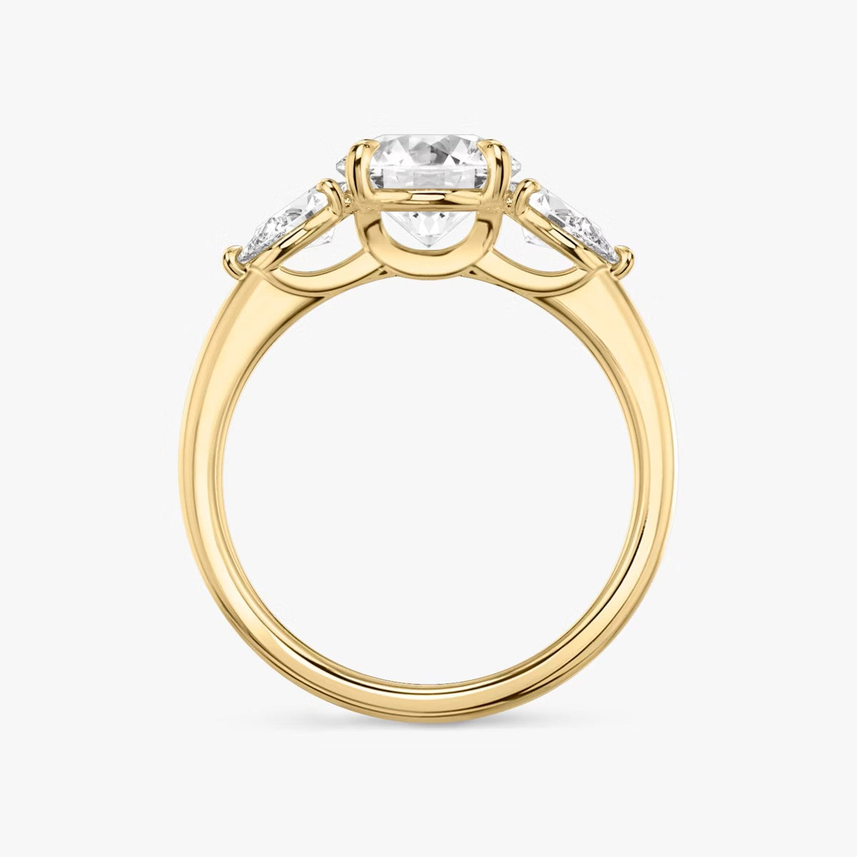 The Three Stone Round Brilliant With Pear Side Stones Engagement Ring