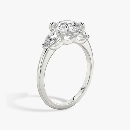 The Three Stone Round Brilliant With Pear Side Stones Engagement Ring