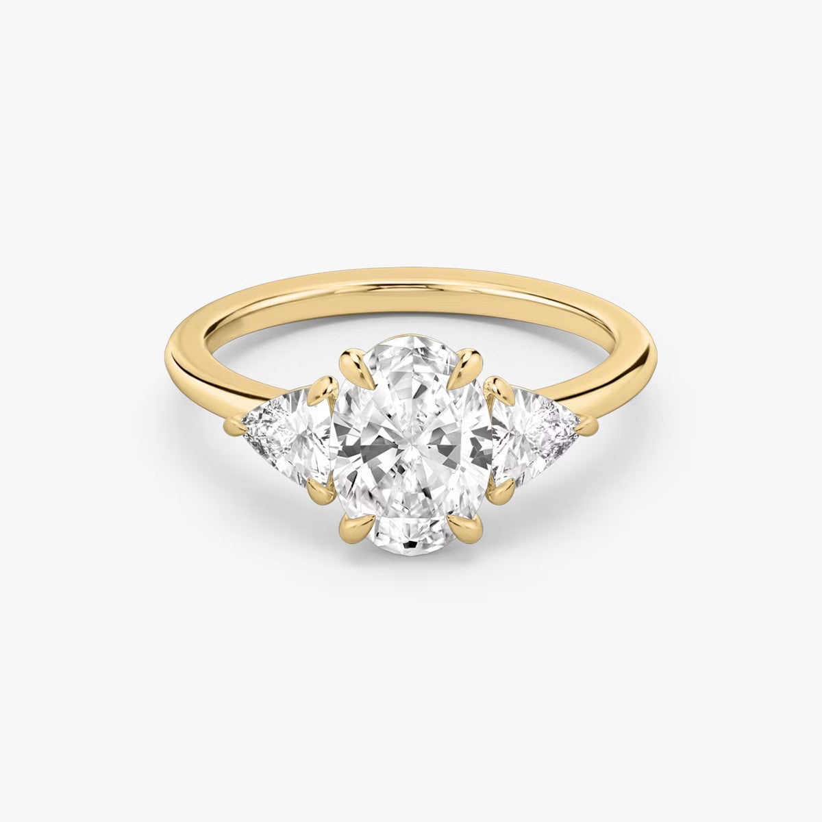 The Three Stone Oval with Trillion side stones Engagement Ring