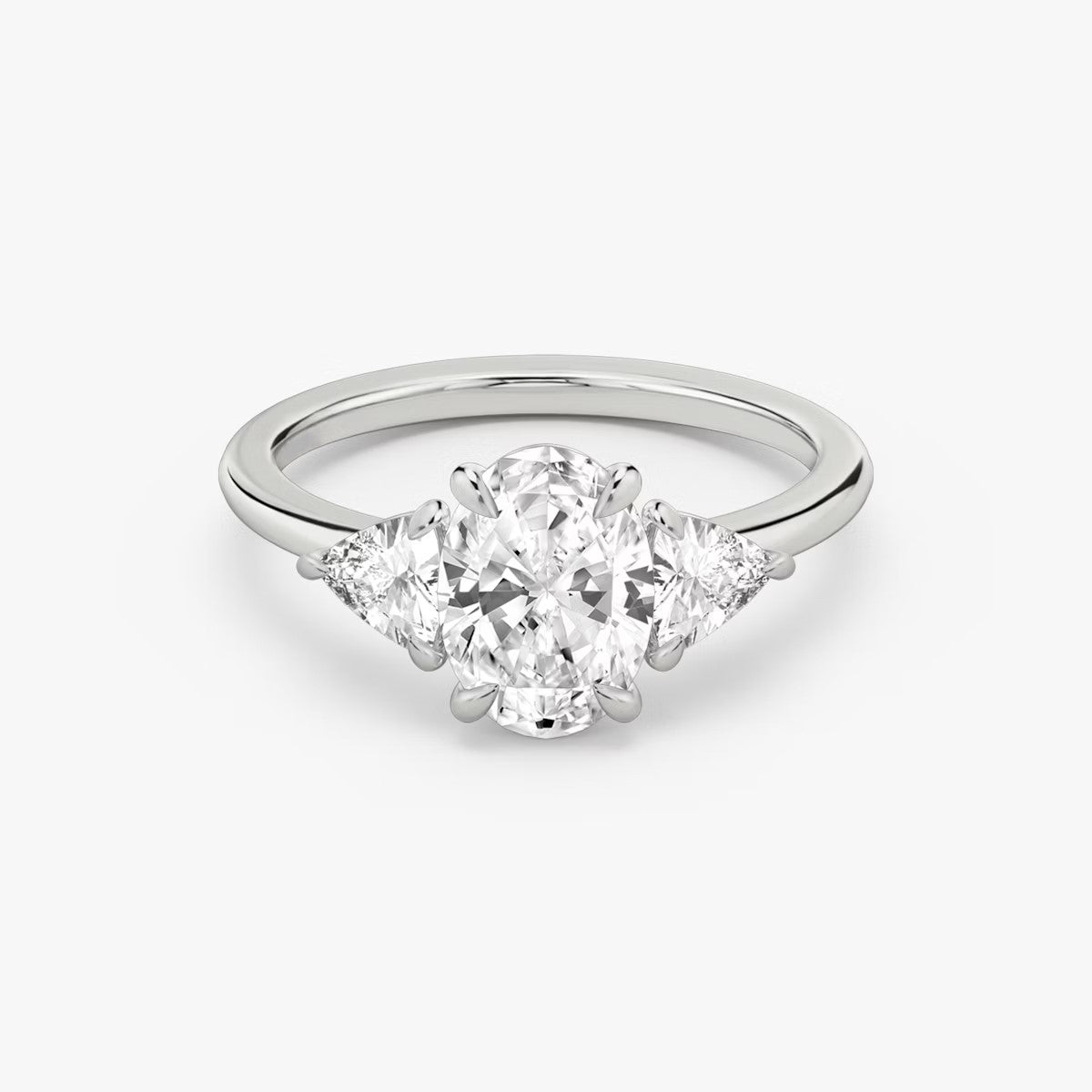 The Three Stone Oval with Trillion side stones Engagement Ring