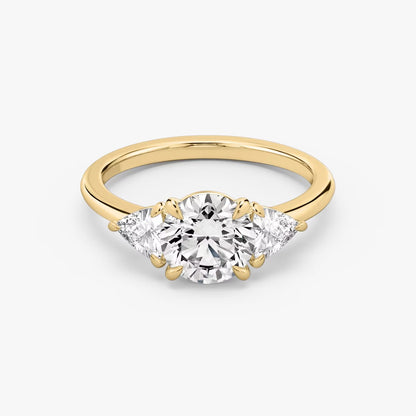 The Three Stone Round Brilliant with Trillion Side Stones Engagement Ring