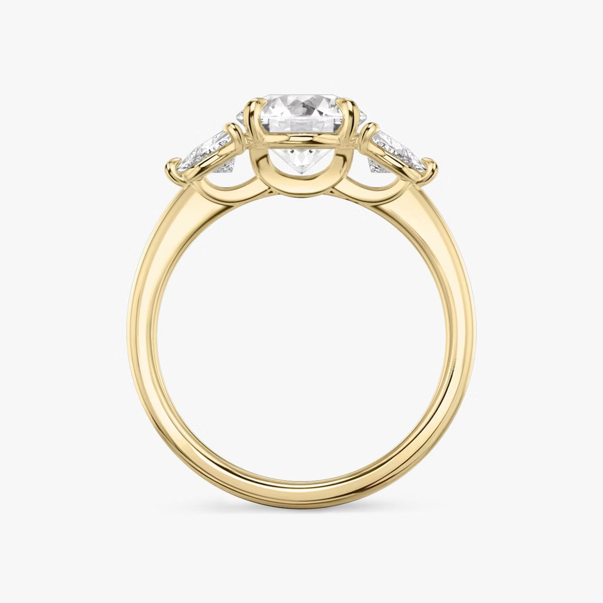 The Three Stone Round Brilliant with Trillion Side Stones Engagement Ring