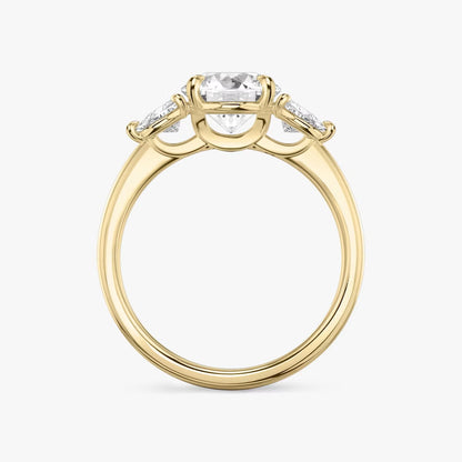 The Three Stone Round Brilliant with Trillion Side Stones Engagement Ring