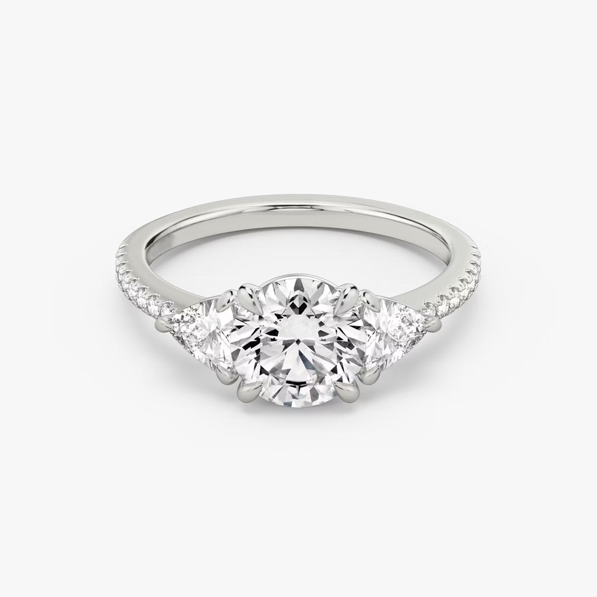 The Three Stone Round Brilliant with Trillion Side Stones Pave Engagement Ring