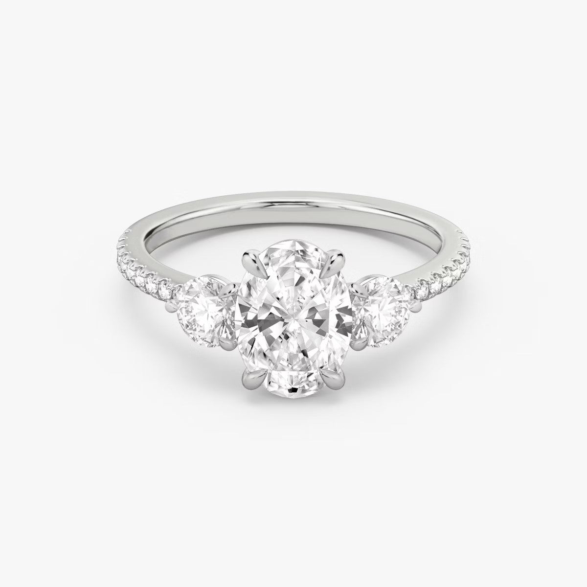 The Three Stone Oval with Round Side Stones Pave Engagement Ring