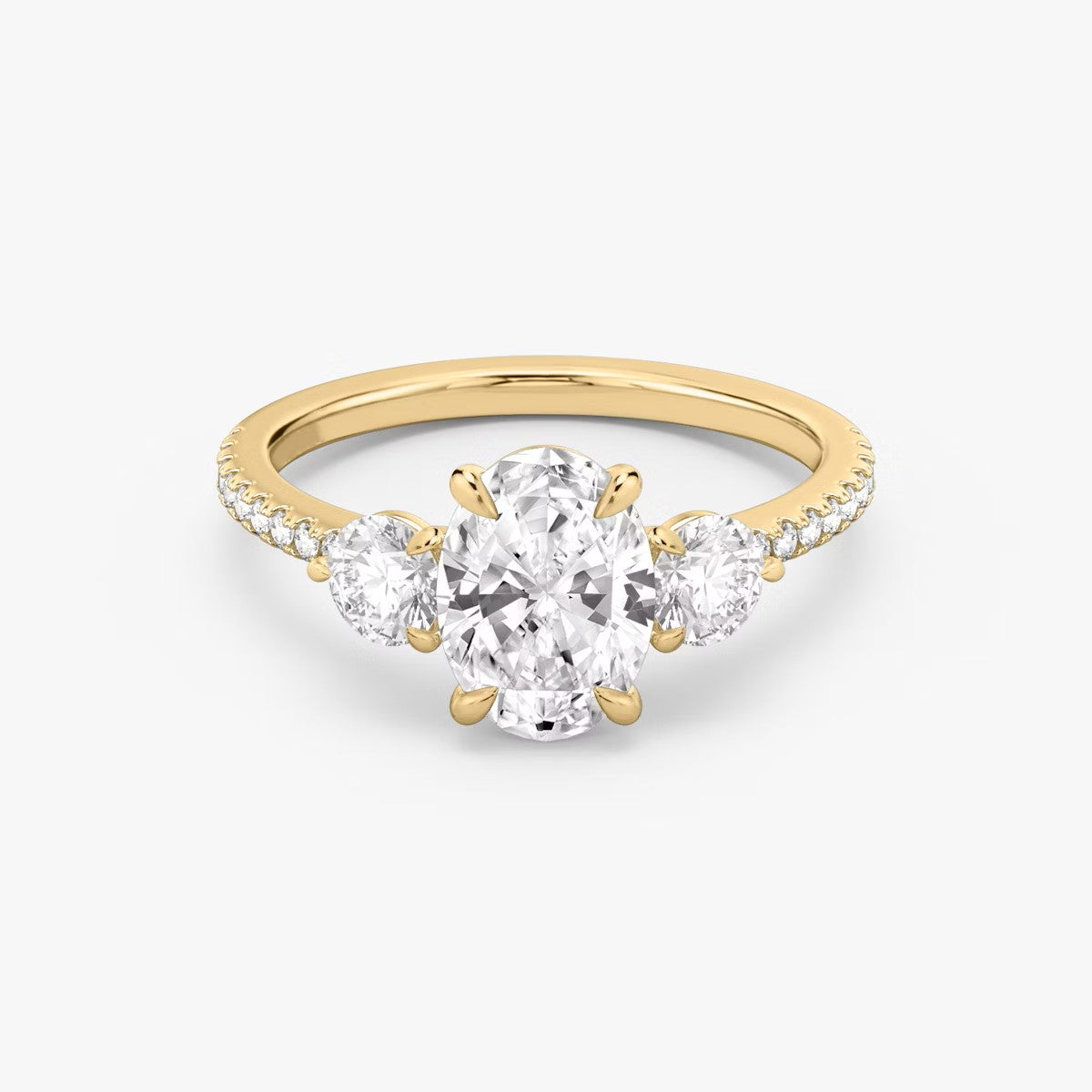 The Three Stone Oval with Round Side Stones Pave Engagement Ring