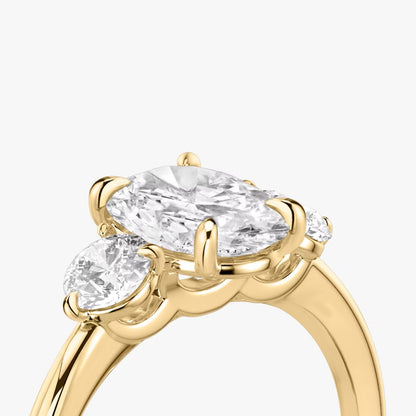 The Three Stone Oval with Round side stones Engagement Ring