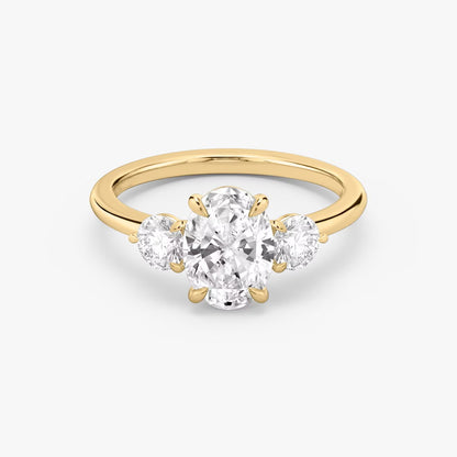 The Three Stone Oval with Round side stones Engagement Ring