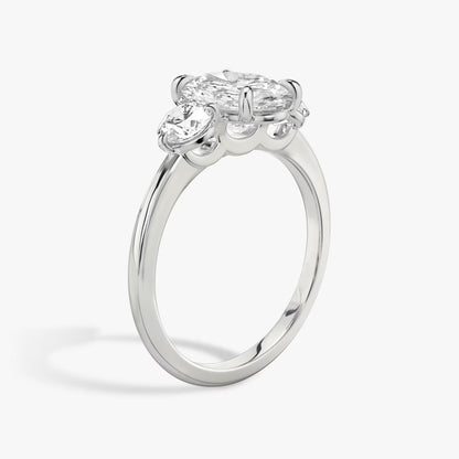 The Three Stone Oval with Round side stones Engagement Ring