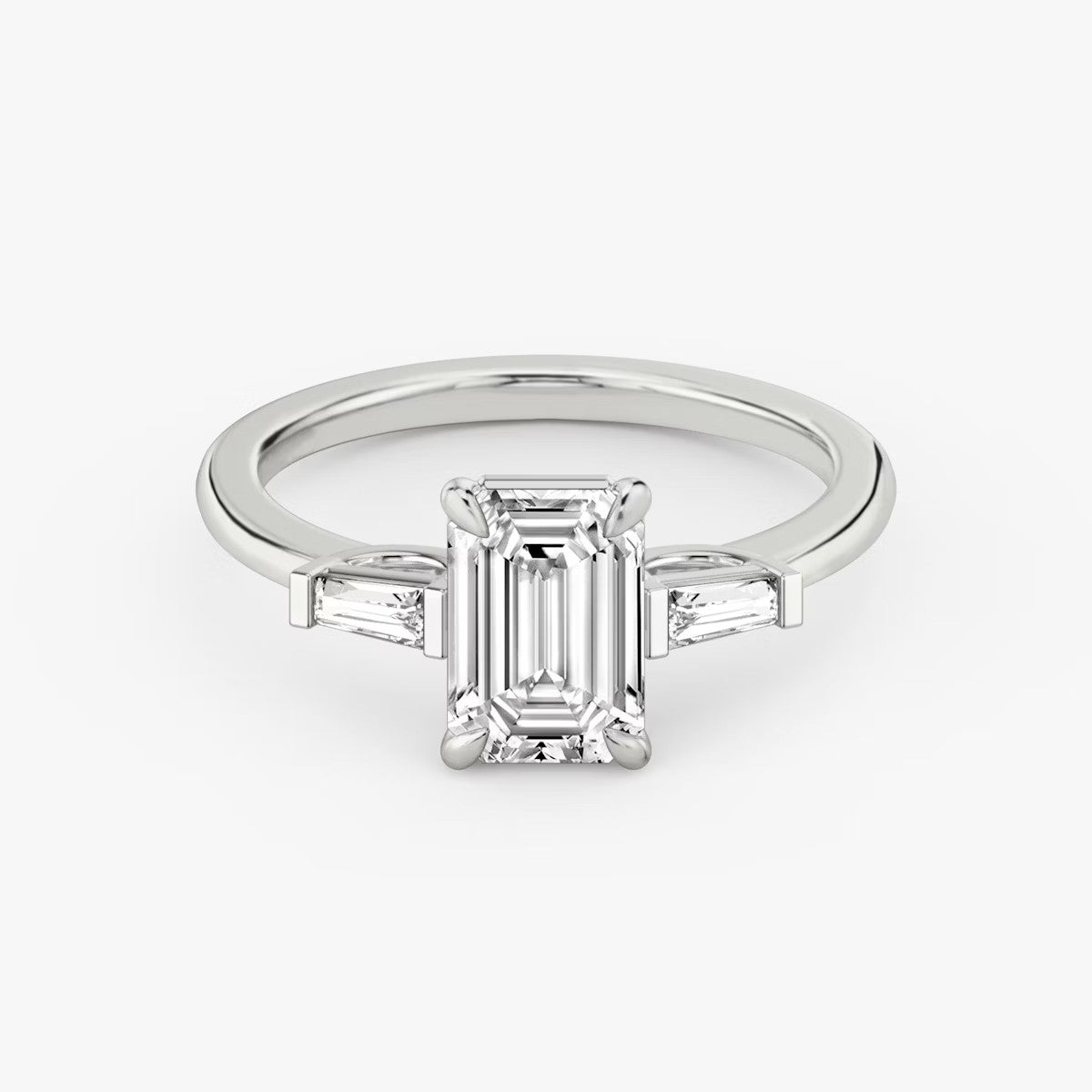 The Three Stone Emerald with Tapered baguette side stones Engagement Ring