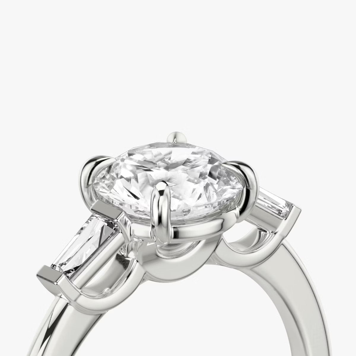 The Three Stone Round Brilliant with Tapered baguette Side Stones Engagement Ring