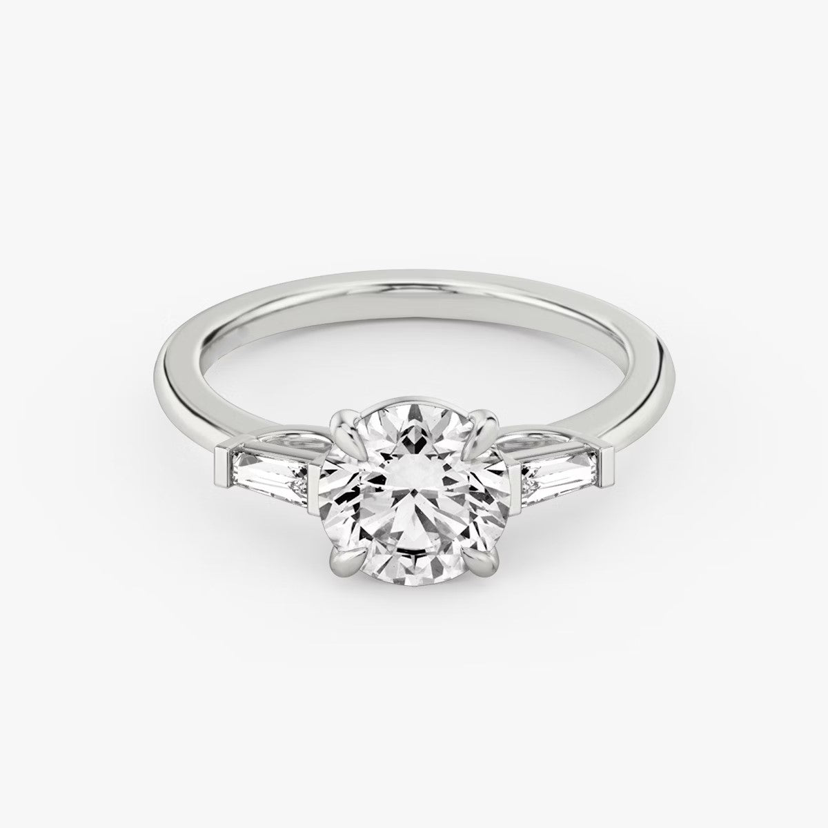 The Three Stone Round Brilliant with Tapered baguette Side Stones Engagement Ring