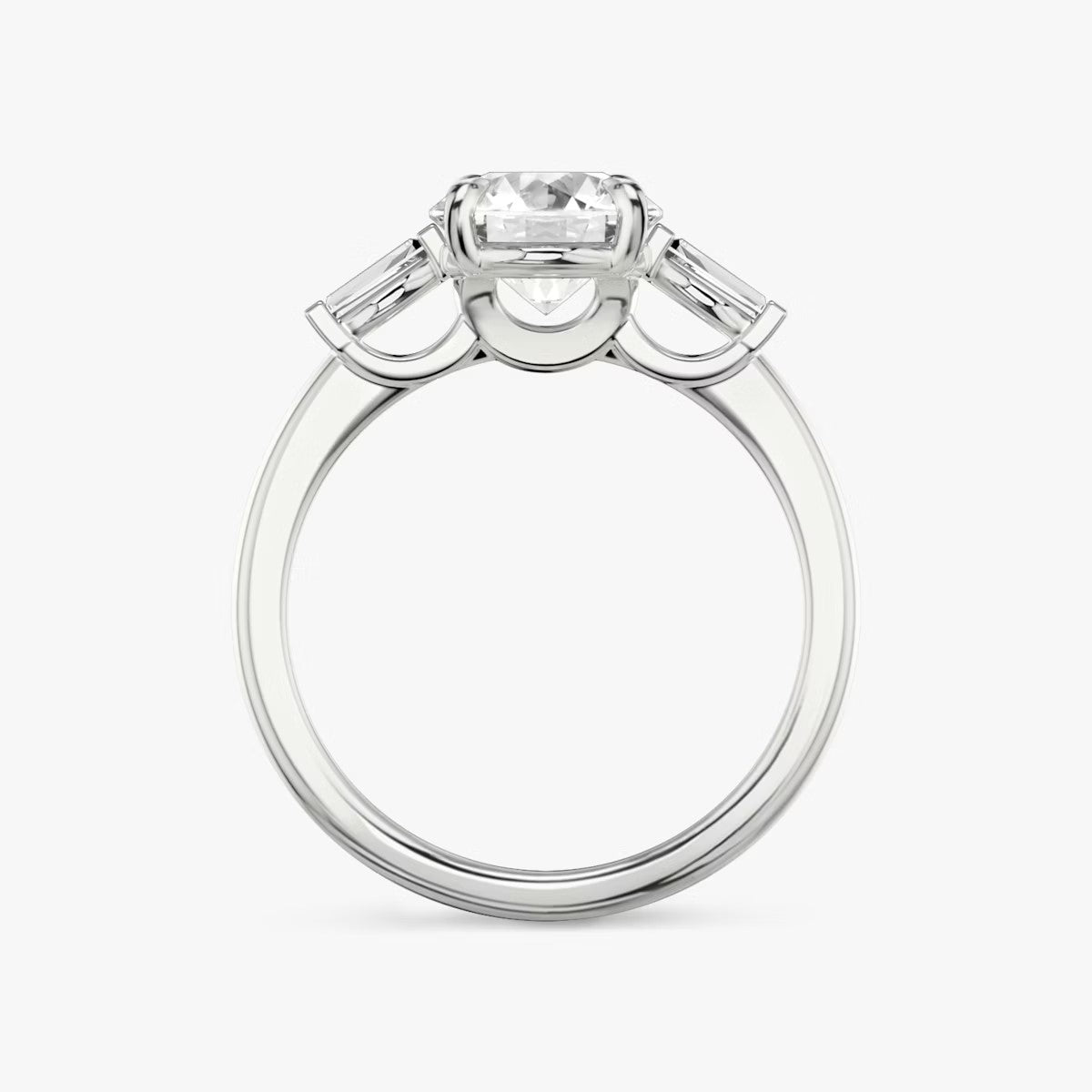 The Three Stone Round Brilliant with Tapered baguette Side Stones Engagement Ring