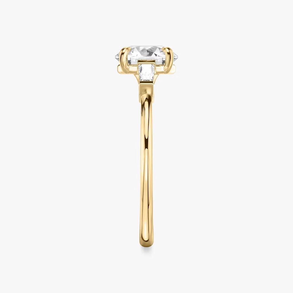 The Three Stone Round Brilliant with Tapered baguette Side Stones Engagement Ring