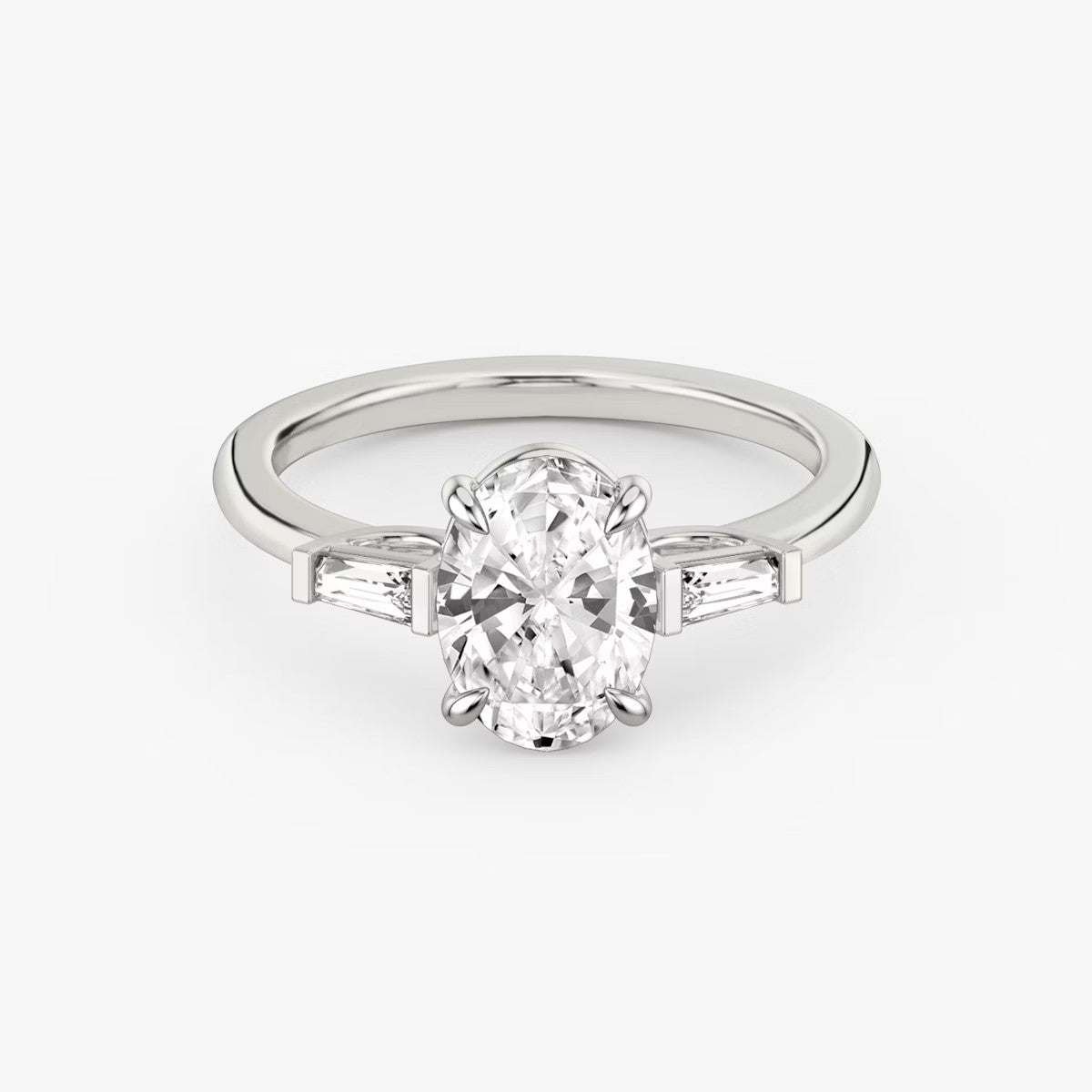 The Three Stone Oval with Tapered Baguette side stones Engagement Ring