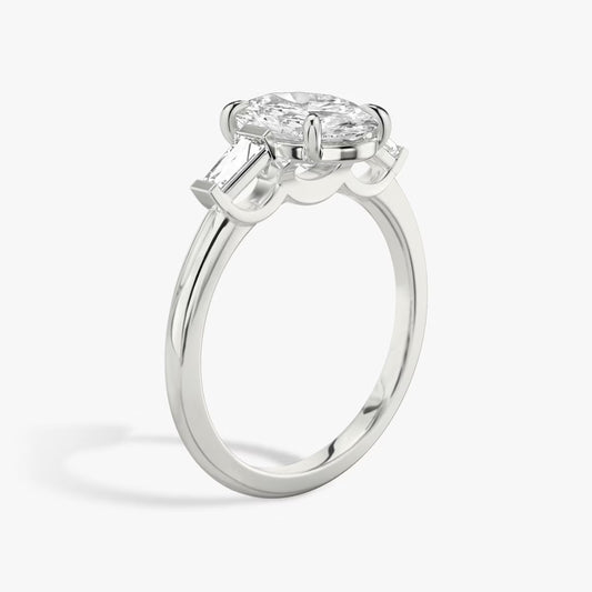 The Three Stone Oval with Tapered Baguette side stones Engagement Ring