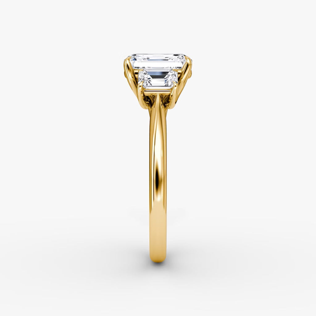 The Erelis Three Stone Emerald Engagement Ring