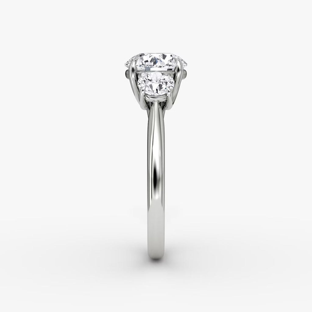 The Erelis Three Stone Round Brilliant Engagement Ring