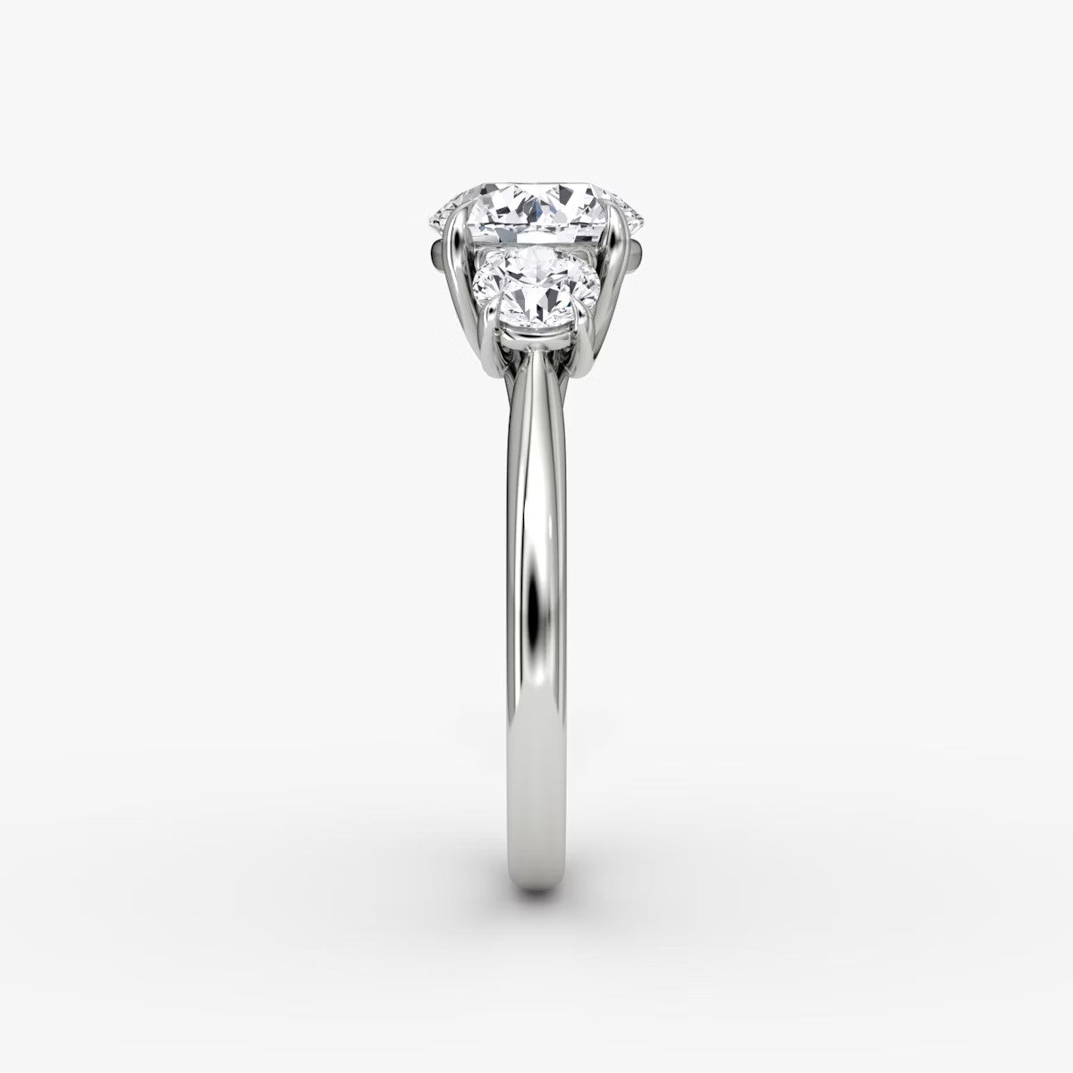 The Erelis Three Stone Round Brilliant Engagement Ring