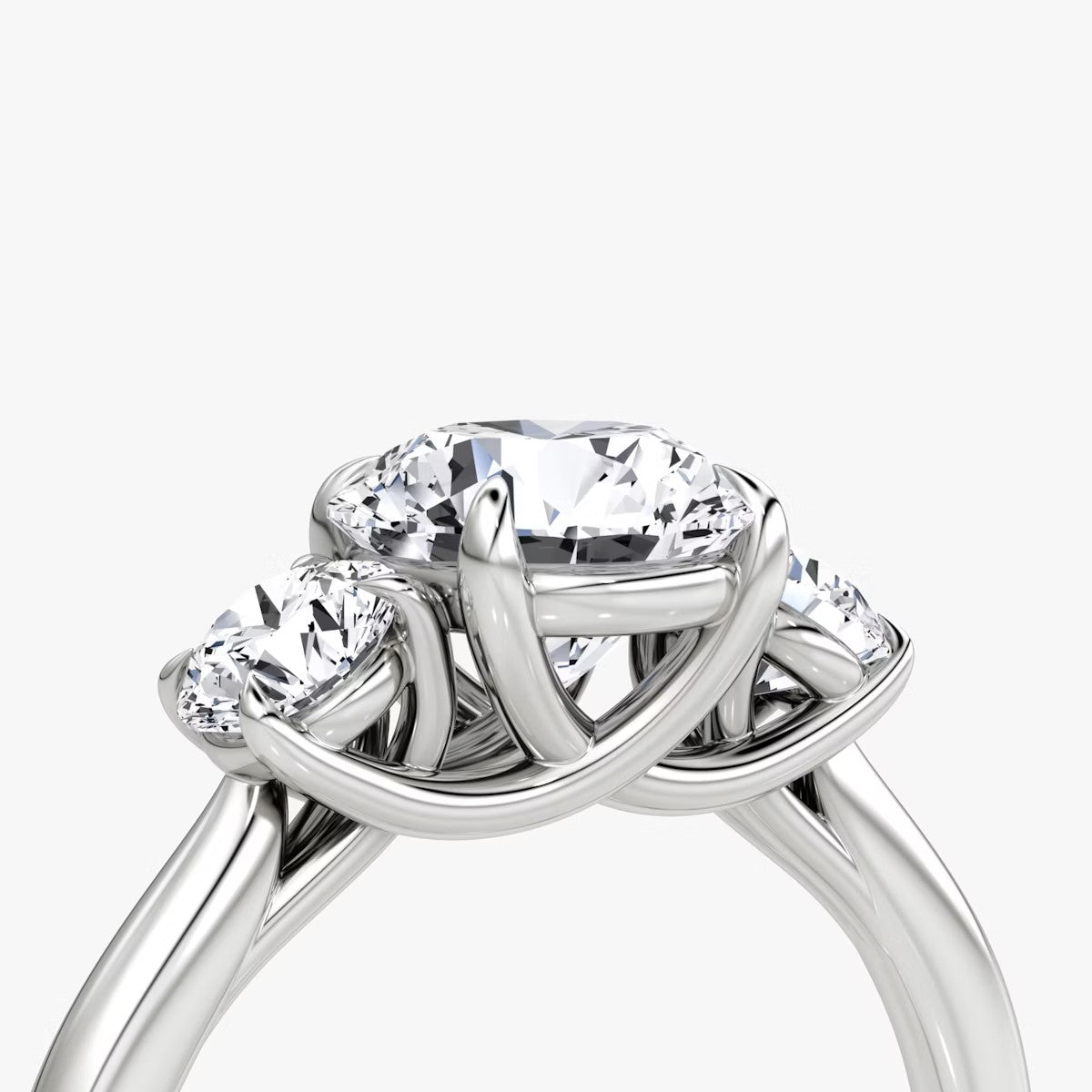 The Erelis Three Stone Round Brilliant Engagement Ring