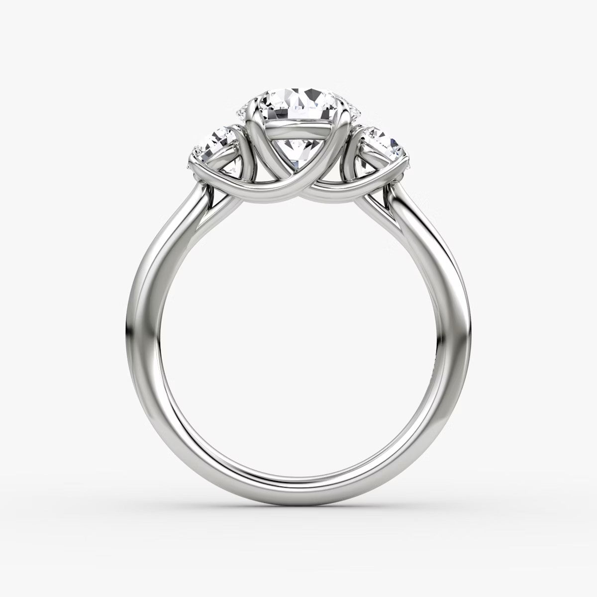 The Erelis Three Stone Round Brilliant Engagement Ring