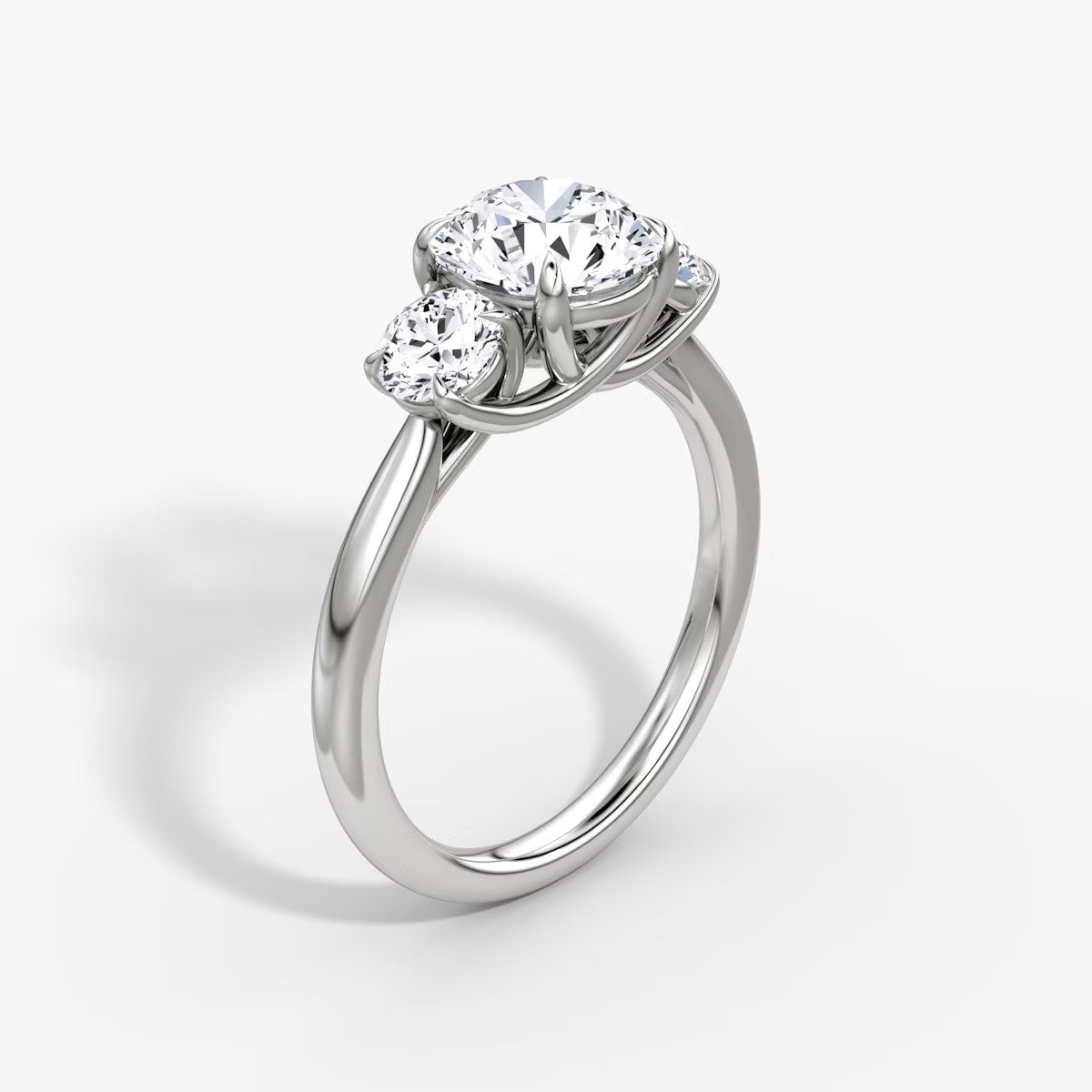 The Erelis Three Stone Round Brilliant Engagement Ring