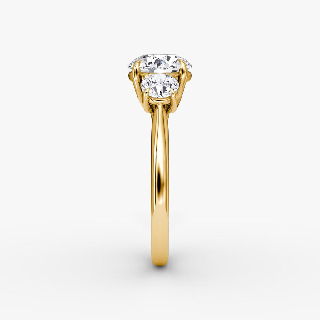 The Erelis Three Stone Round Brilliant Engagement Ring