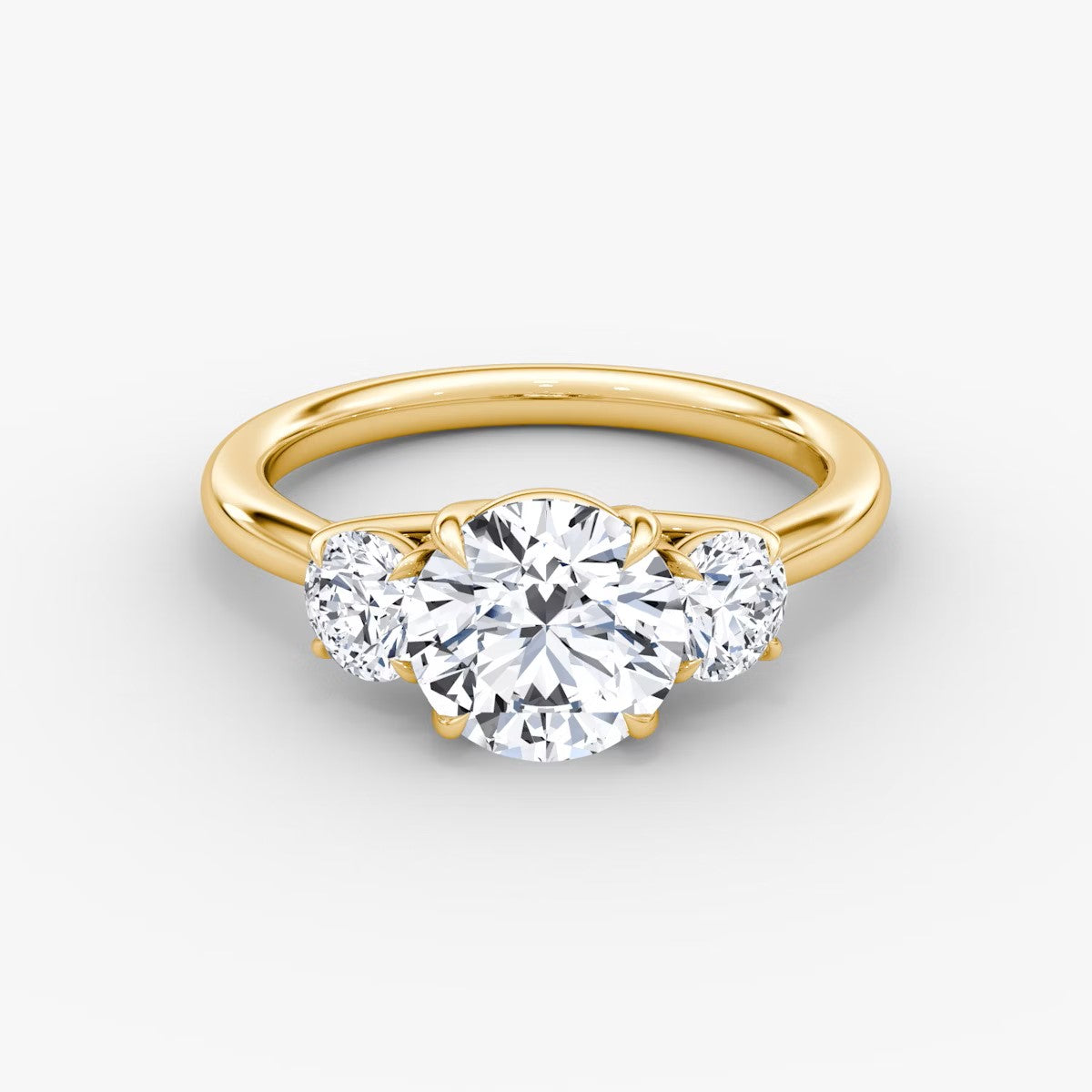 The Erelis Three Stone Round Brilliant Engagement Ring