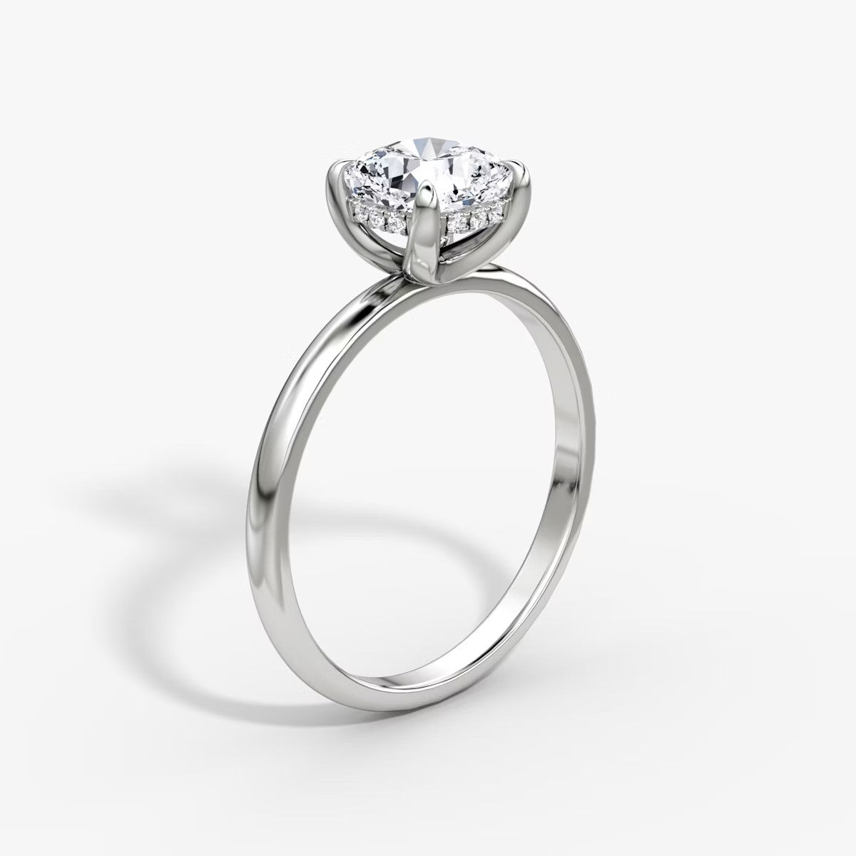 The Classic Cushion Cut Solitaire Hidden Halo Engagement Ring