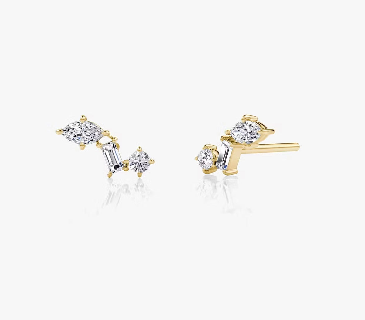 a pair of gold earrings with diamonds