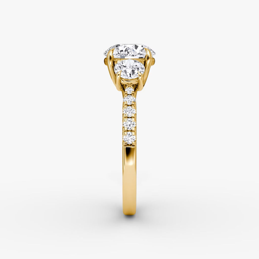 The Erelis Three Stone Round Brilliant Pave Engagement Ring