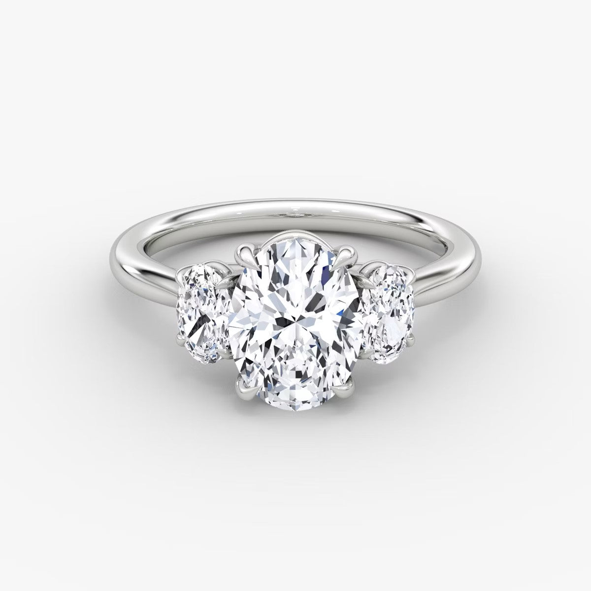 The Erelis Three Stone Oval Engagement Ring