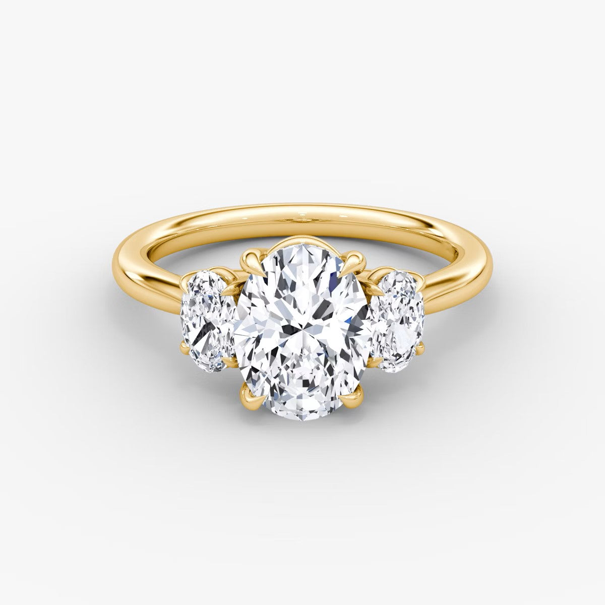 The Erelis Three Stone Oval Engagement Ring